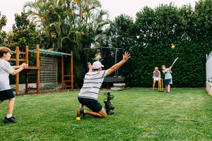 Family playing in the yard with Pitch It Up Cricket Training aid. Best value training aid for cricket. Use at home or take with you to the park, nets or oval.  May soon by sold at Greg Chappell Cricket Centre. Cricket Warehouse.
